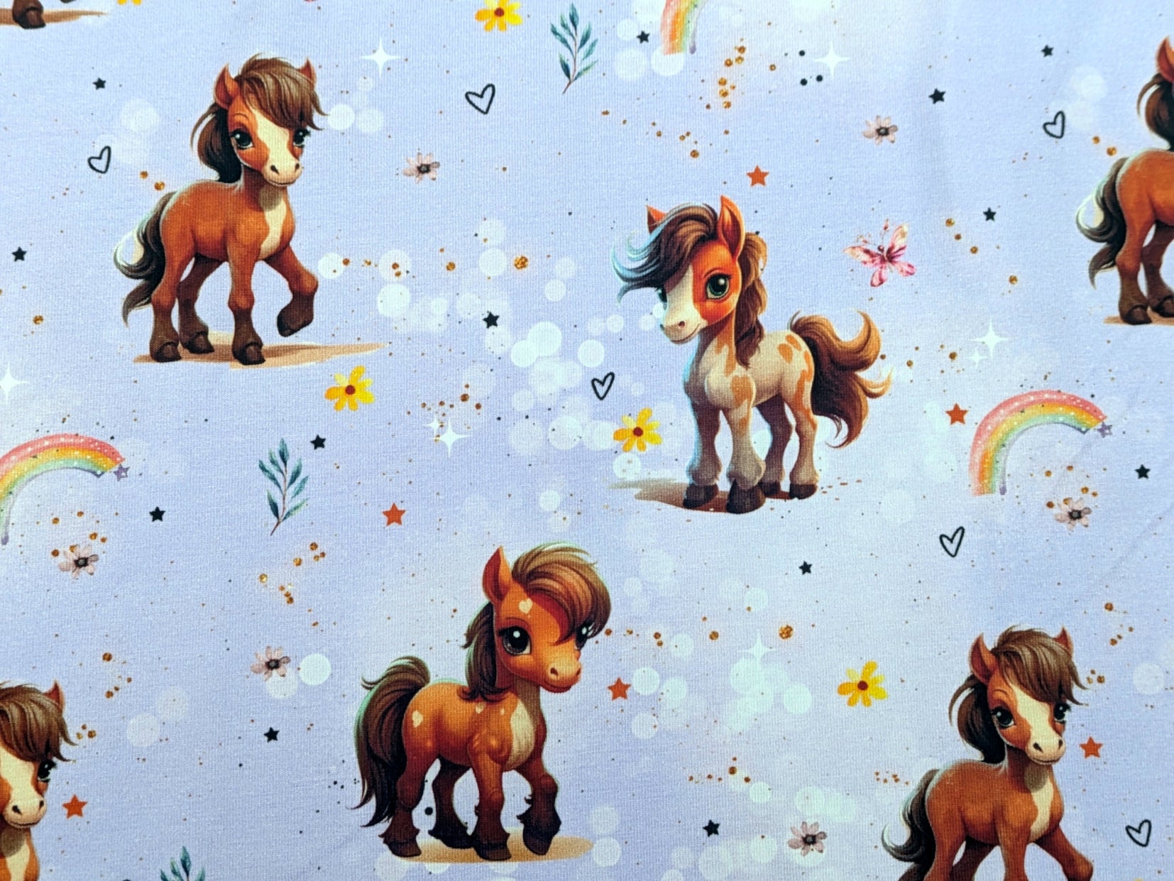 Eigenproduktion Baumwolljersey Rainbow Pony auf Flieder