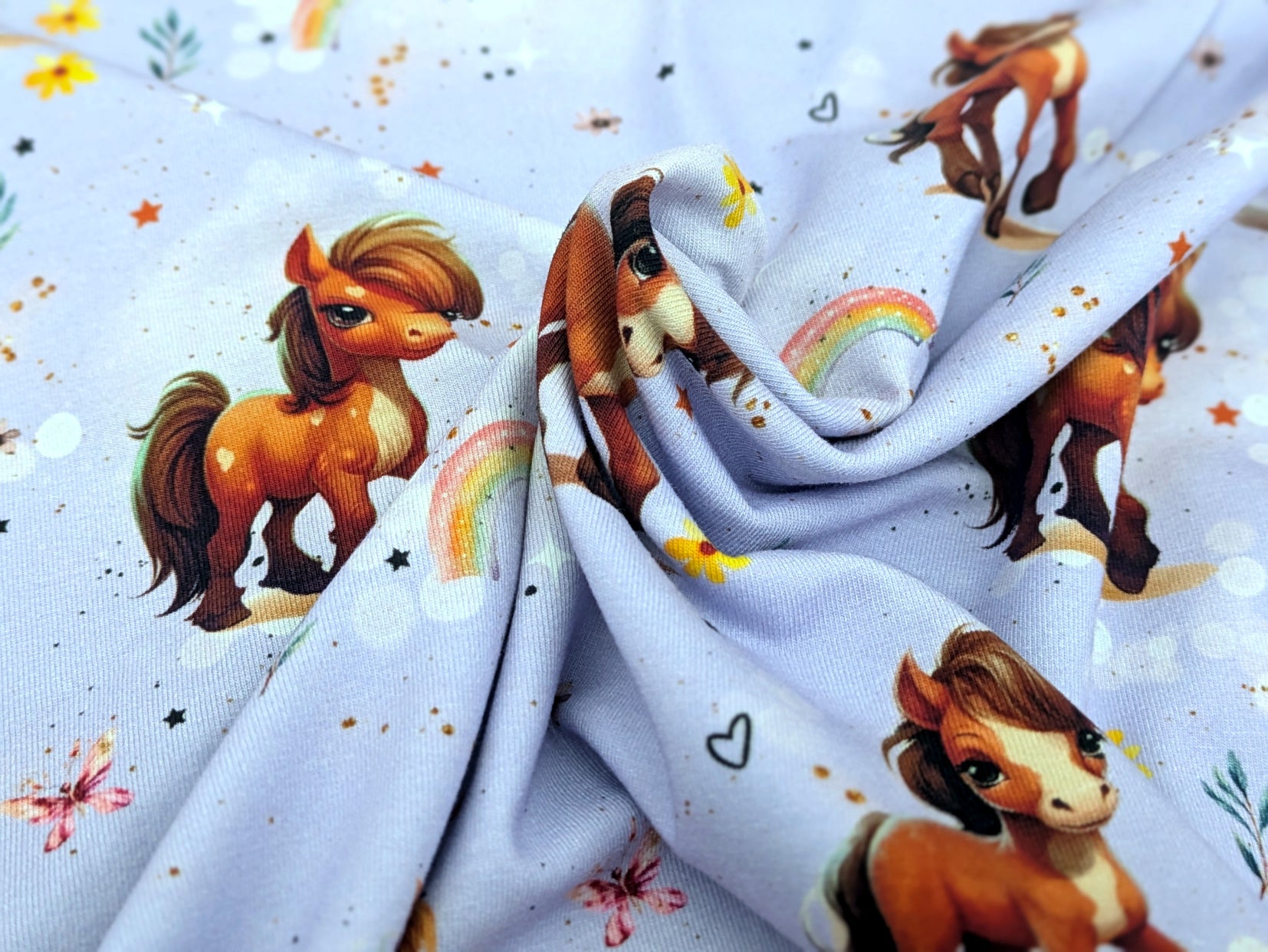 Eigenproduktion Baumwolljersey Rainbow Pony auf Flieder