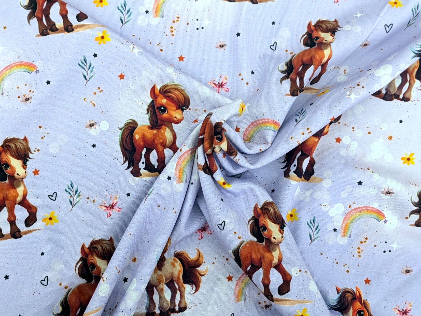 Eigenproduktion Baumwolljersey Rainbow Pony auf Flieder